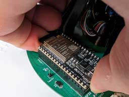 close-up photograph of removing the EPS32 microcontroller